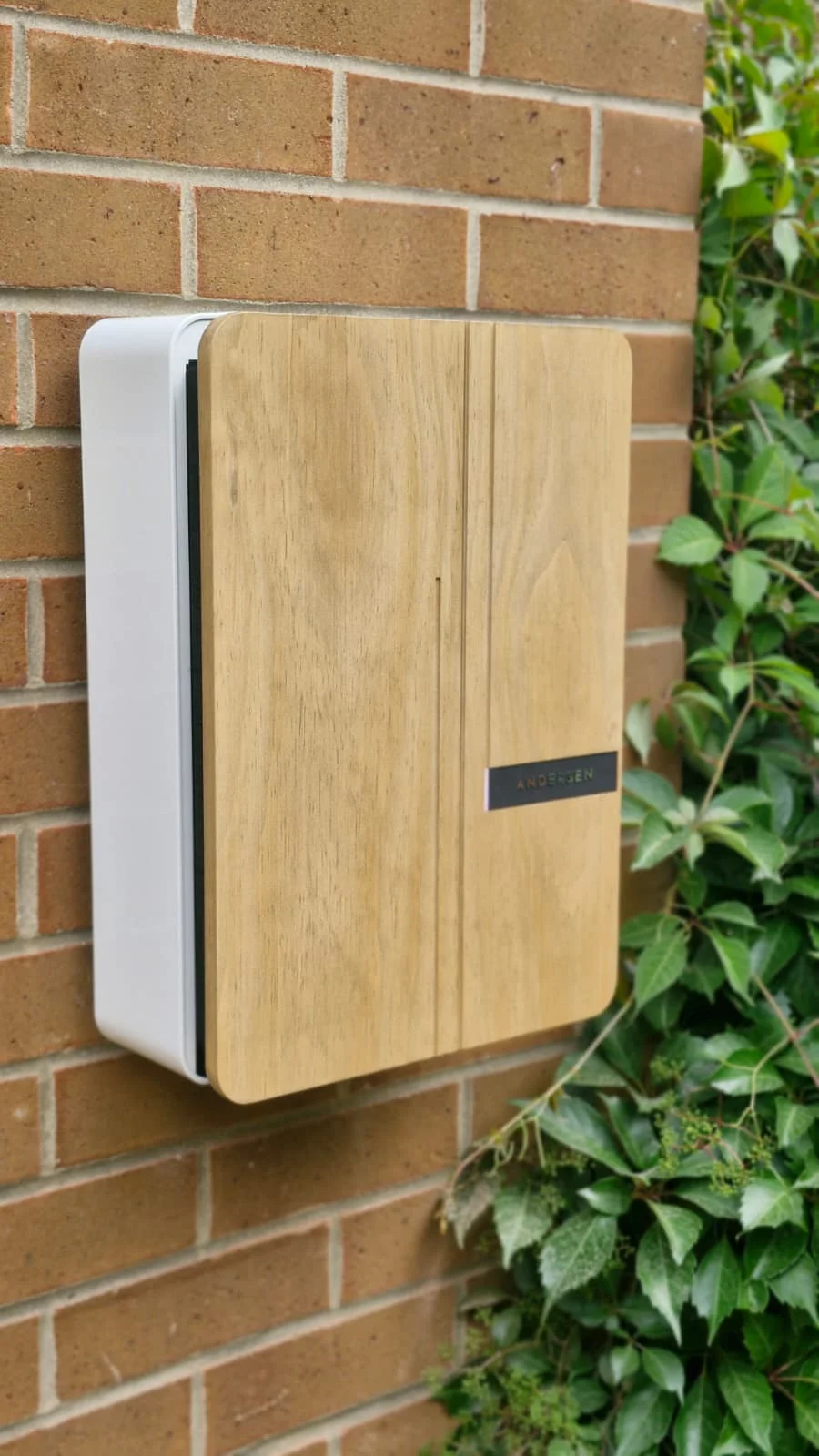 Premium Andersen A2 EV charger with hardwood fascia installed on a brick wall in Wakefield by Knox Power & Data