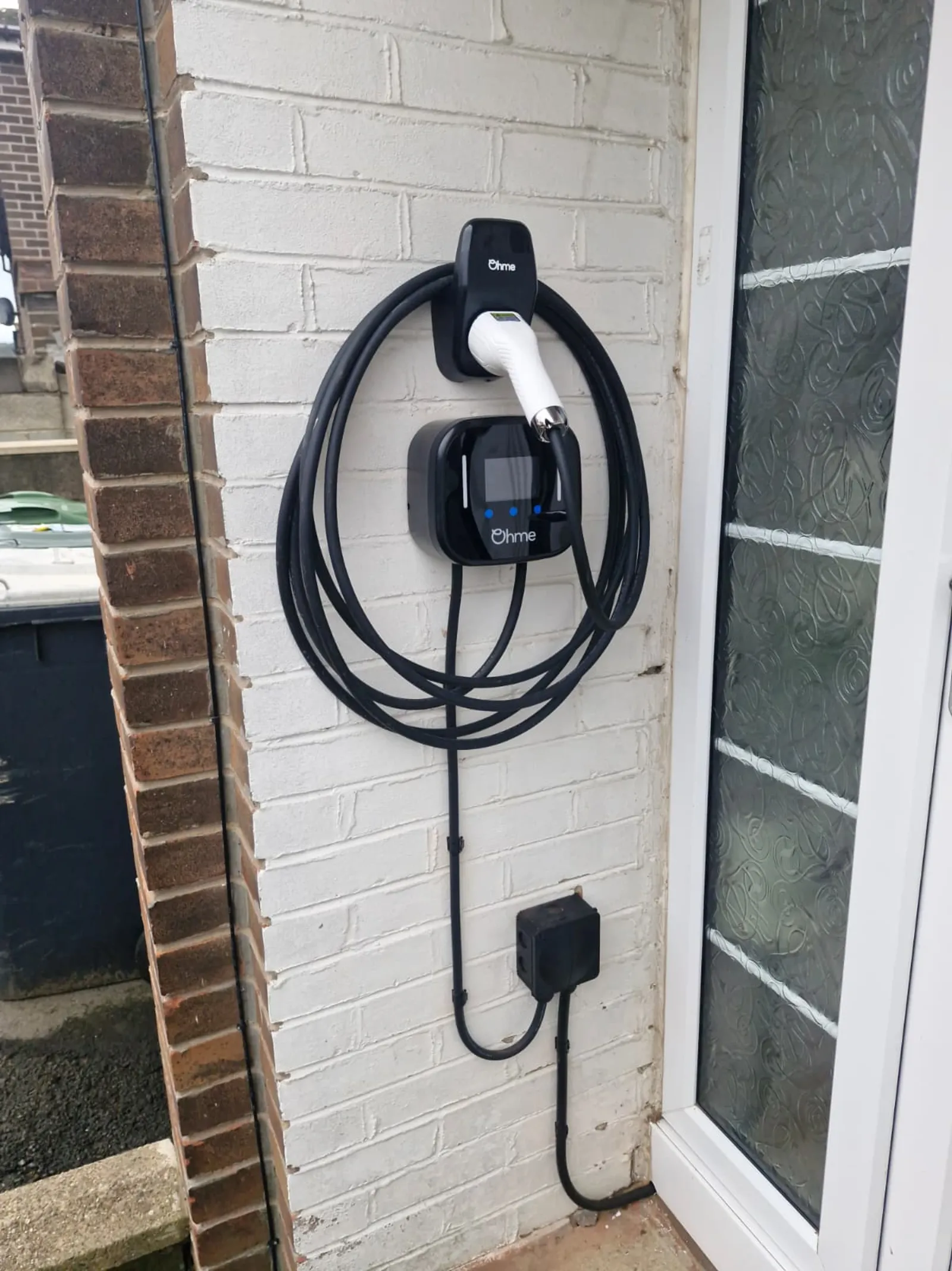 EV charger cable routing along external wall in Wakefield