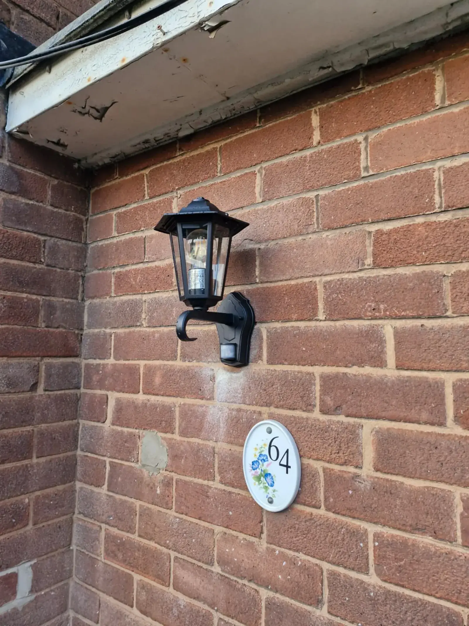Lantern light installation by front door in Wakefield